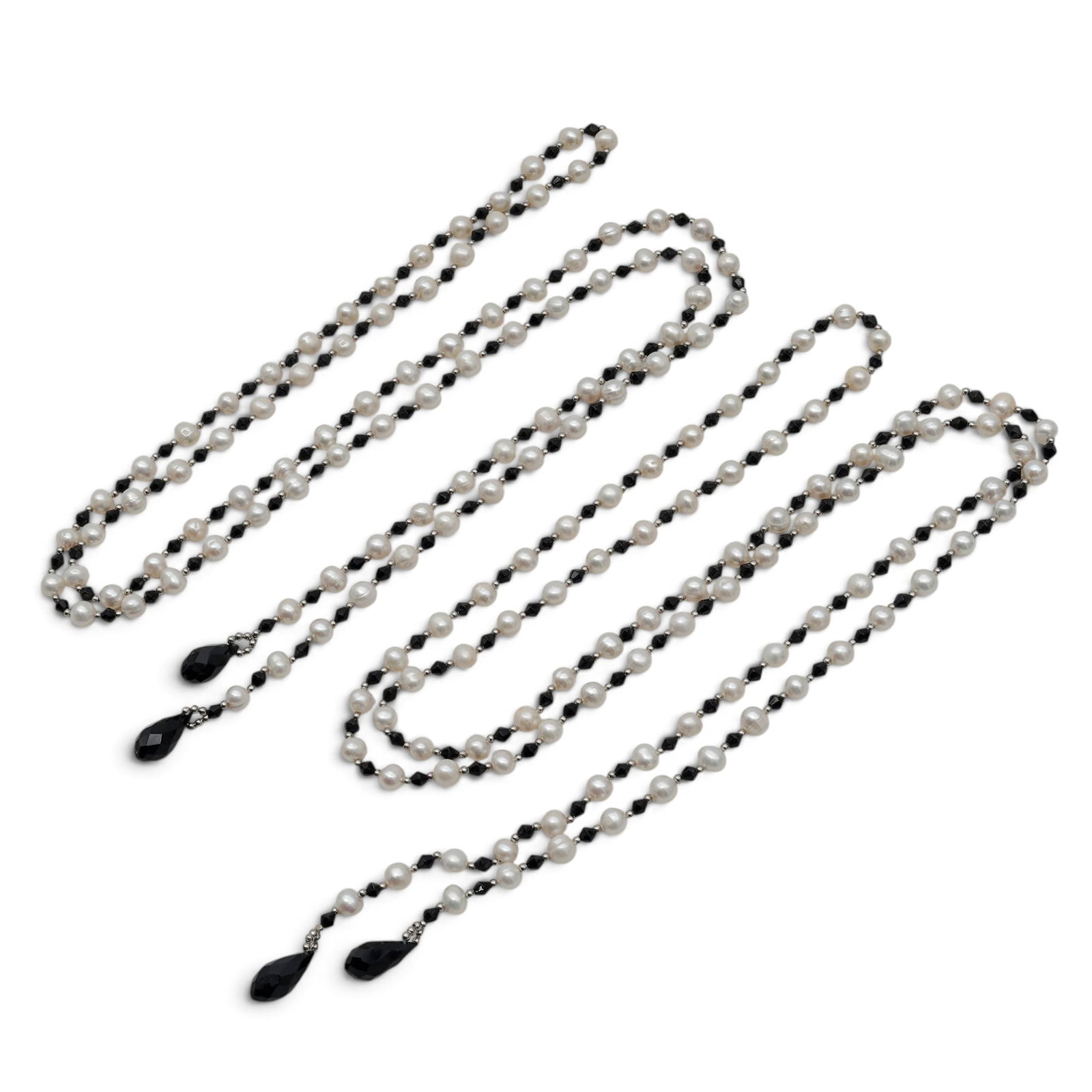 (2pc) Designer Long Strand Freshwater Pearl & Black Onyx Lariat Necklace: (2pc) Designer Long Strand Freshwater Pearl & Black Onyx Lariat Necklace 20th Cent. These two long-strand lariat necklaces feature a striking high-contrast design, meticulously crafted with