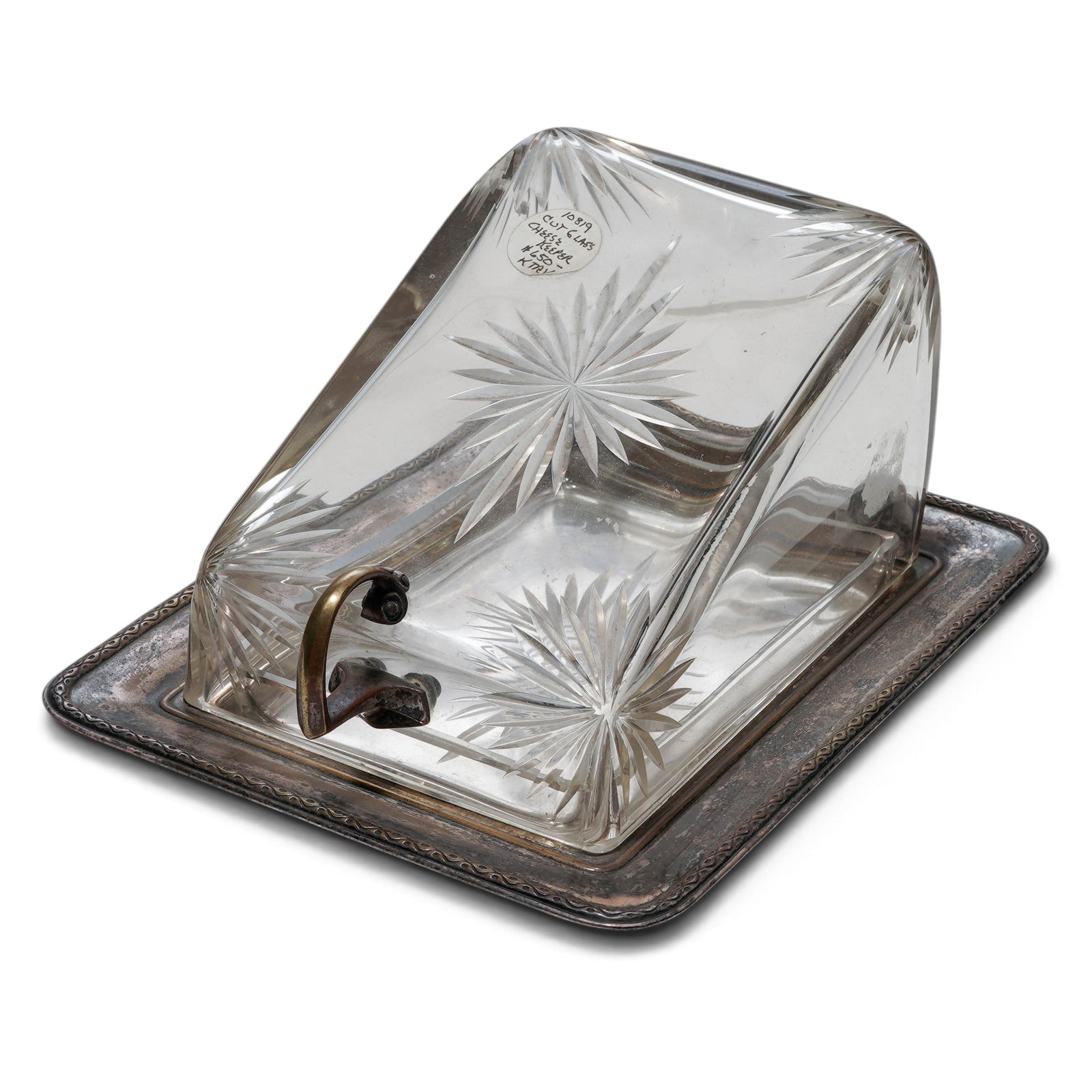 Antique Silver Plated & Cut Glass Wedge Cheese Keeper: Antique Silver Plated & Cut Glass Wedge Cheese Keeper 19th Century, Germany Antique cut glass wedge-form cheese keeper with deeply cut starburst decoration, fitted to a silverplate serving tray with d