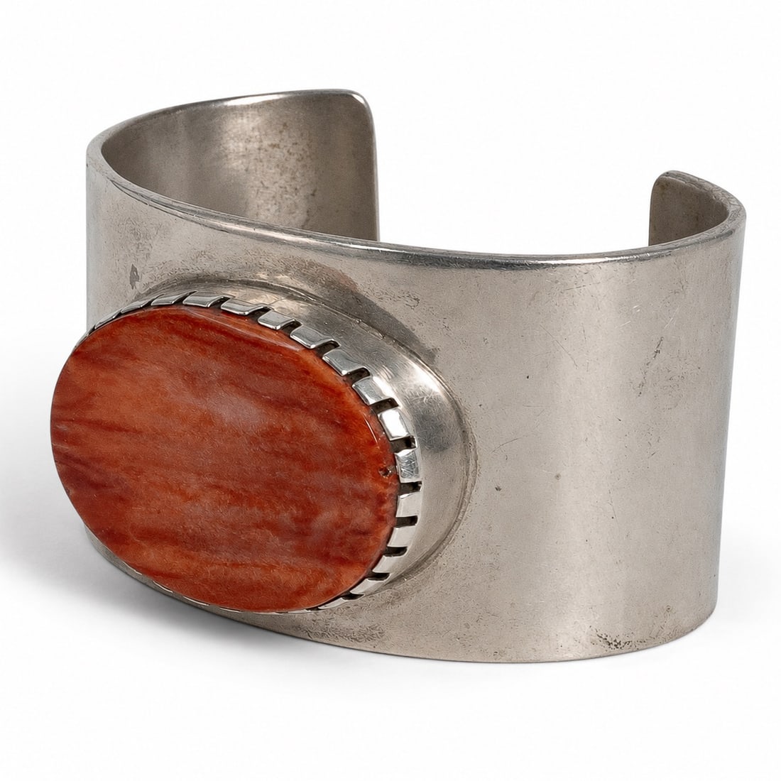 General B. Grant Cherokee Sterling Silver & Red Spiny Oyster Cuff: General B. Grant Cherokee Sterling Silver & Red Spiny Oyster Cuff 1970-1980s, USA Vintage Cherokee sterling silver wide cuff bracelet by General B. Grant, featuring a heavy polished sterling silver cu