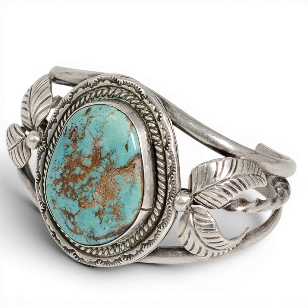 Vintage Navajo Sterling Silver & Turquoise Cuff Bracelet: Vintage Navajo Sterling Silver & Turquoise Cuff Bracelet 1970-1980s Vintage Navajo sterling silver cuff bracelet centering a large oval turquoise cabochon with prominent brown matrix in a smooth bezel
