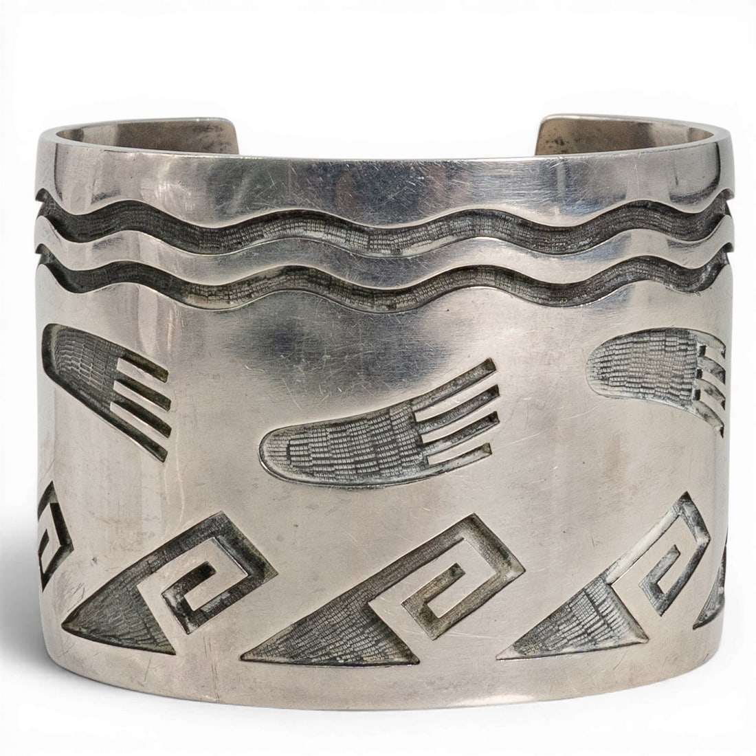 Vintage Clarence Lomayestewa for Hopicrafts Sterling Silver Cuff: Vintage Clarence Lomayestewa for Hopicrafts Sterling Silver Cuff 1970-1980's, USA Vintage Hopi sterling silver cuff bracelet featuring traditional overlay construction with deeply cut and geometric mo