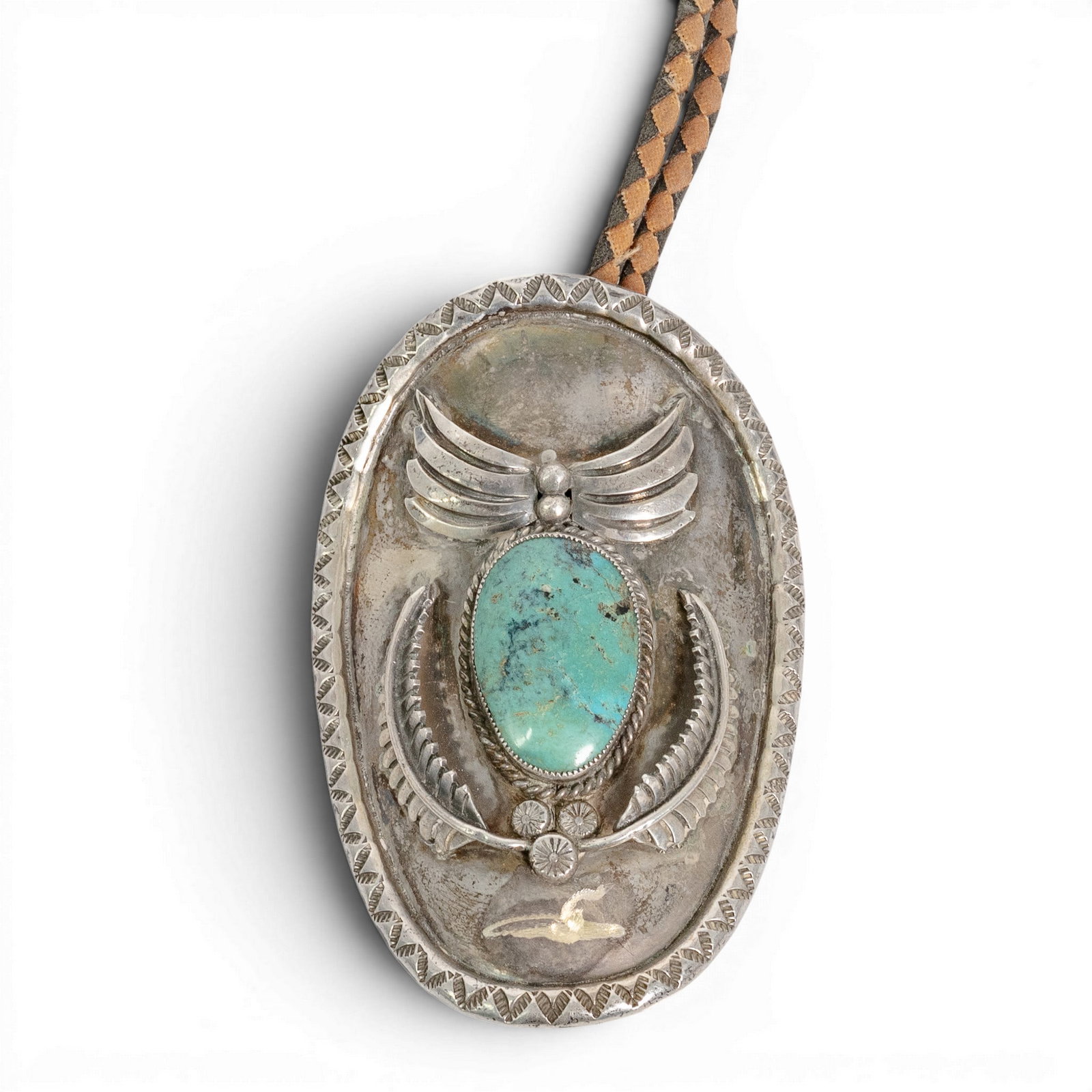 Vintage Navajo Sterling Silver & Turquoise Bolo Tie Signed: Vintage Navajo Sterling Silver & Turquoise Bolo Tie Signed 1970-1980s, USA Vintage Navajo sterling silver bolo tie featuring a large oval turquoise cabochon mounted within an elaborate shadowbox-style