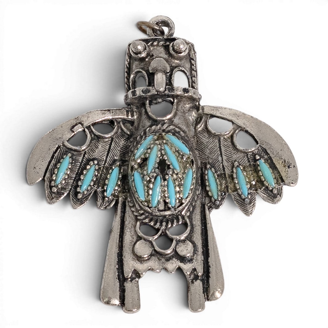 Vintage Navajo Sterling Silver & Turquoise Thunderbird Pendant: Vintage Navajo Sterling Silver & Turquoise Thunderbird Pendant 1970-1980s, USA Vintage Navajo sterling silver pendant in the form of a stylized Thunderbird. The pendant is adorned with multiple turquo