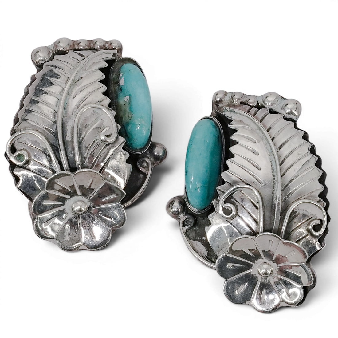 Vintage Caravantes Mexican Sterling Silver & Turquoise Clip Earrings: Vintage Caravantes Mexican Sterling Silver & Turquoise Clip Earrings 1970s-1980s, Mexican Vintage Caravantes Mexican sterling silver clip earrings featuring oval turquoise cabochons with stamped silve