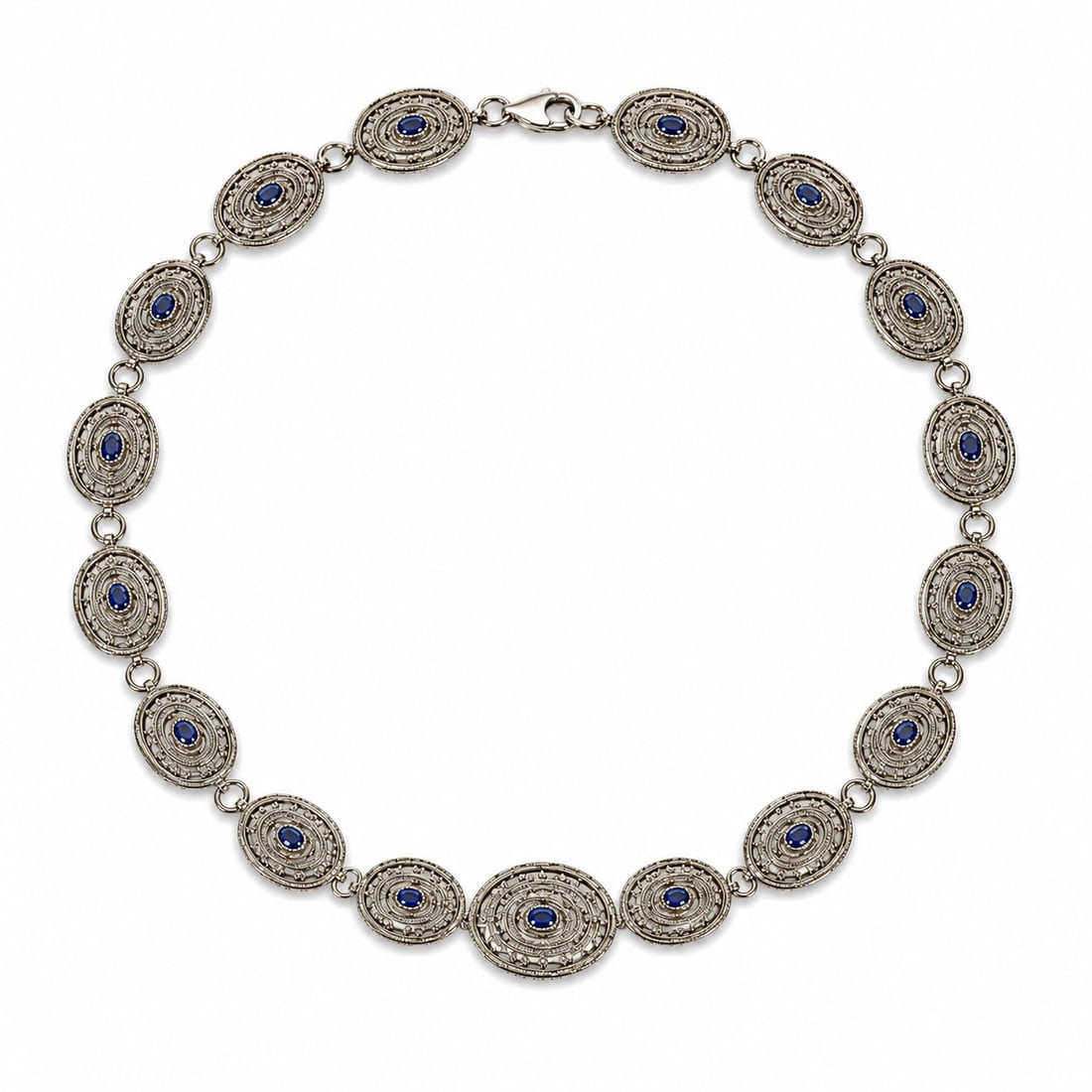 Vintage Navajo Sterling Silver & Lapis Lazuli Concho Belt: Vintage Navajo Sterling Silver & Lapis Lazuli Concho Belt 1970-1980s, USA Vintage sterling silver concho belt comprising oval hand-stamped conchos joined by twisted ring connectors, each centered with