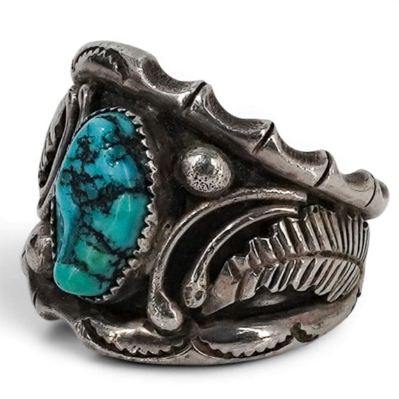 Vintage Navajo Sterling Silver & Turquoise Ring: Vintage Navajo Sterling Silver & Turquoise Ring 1970-1980s, USA Vintage Navajo sterling silver ring featuring an oval turquoise cabochon with vibrant blue-green coloration and natural matrix. The ston