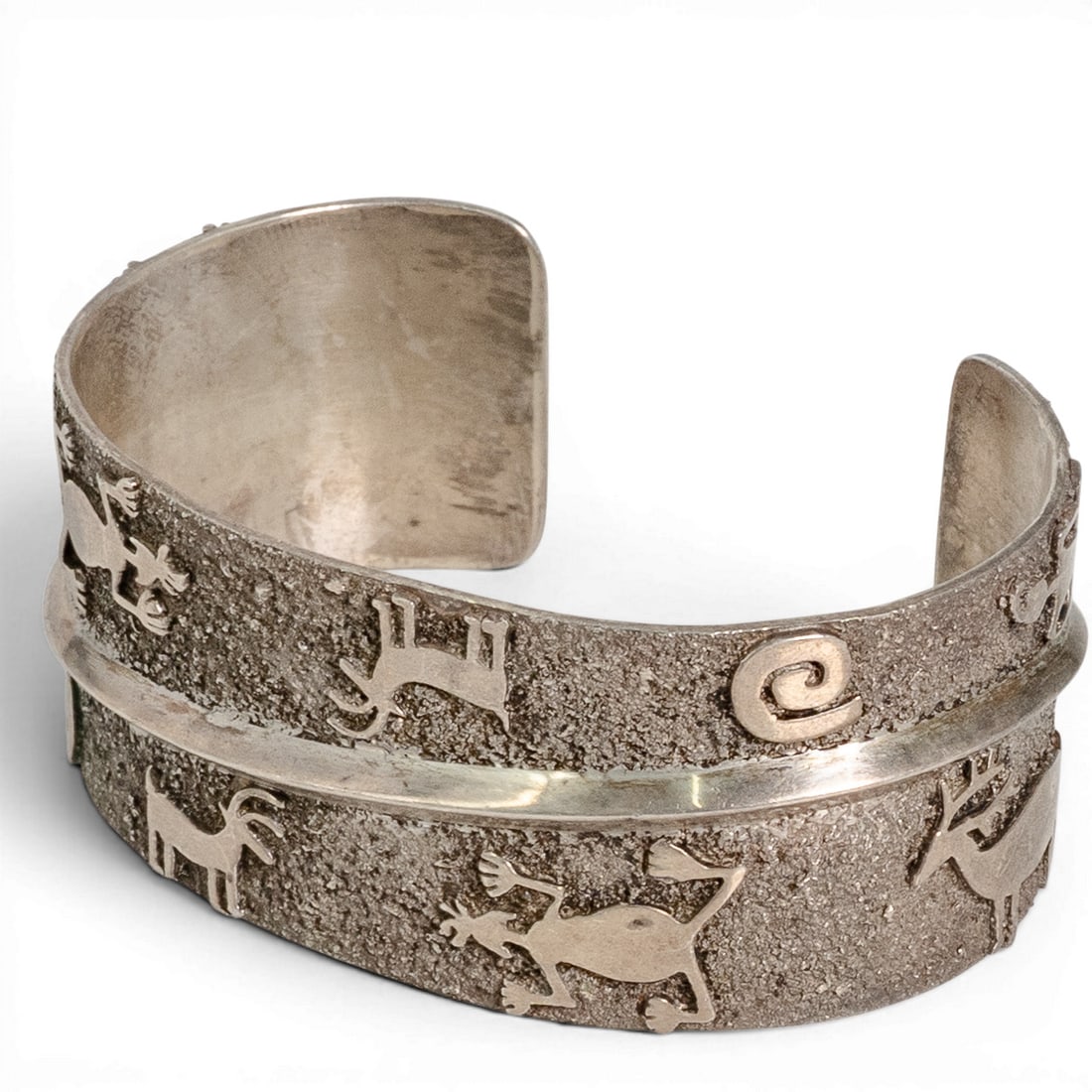 Vintage Christin Wolf Navajo Sterling Silver Petroglyph Cuff Bracelet: Vintage Christin Wolf Navajo Sterling Silver Petroglyph Cuff Bracelet 1970-1980s Vintage sterling silver cuff bracelet by Navajo silversmith Christin Wolf, featuring a deeply textured ground decorated
