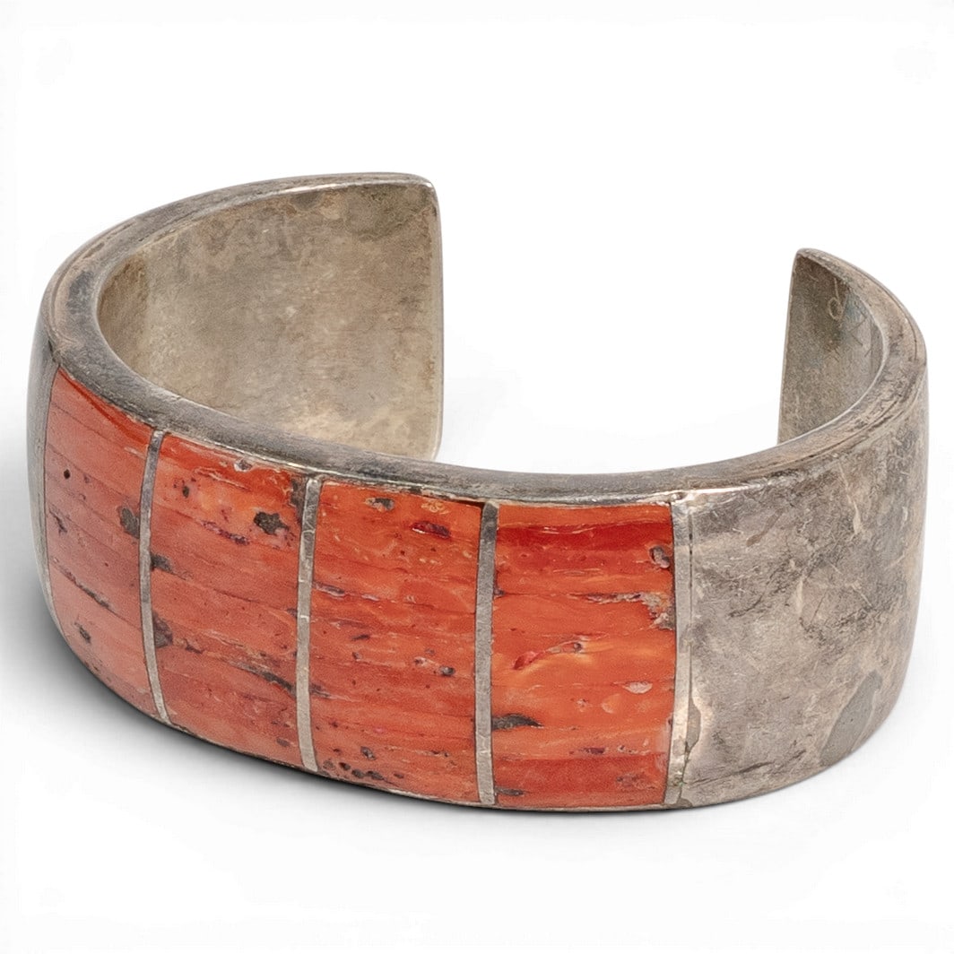 Vintage Navajo Sterling Silver & Coral Inlay Cuff Bracelet: Vintage Navajo Sterling Silver & Coral Inlay Cuff Bracelet 1970-1980s, USA Vintage Navajo sterling silver cuff bracelet featuring a wide channel inlay design composed of vibrant red coral sections sep