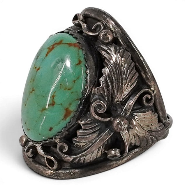 Vintage Navajo Sterling Silver & Turquoise Scrollwork Ring: Vintage Navajo Sterling Silver & Turquoise Scrollwork Ring 1970-1980s, USA Vintage Navajo sterling silver ring featuring a large oval turquoise cabochon in a serrated bezel setting. Decorated with app