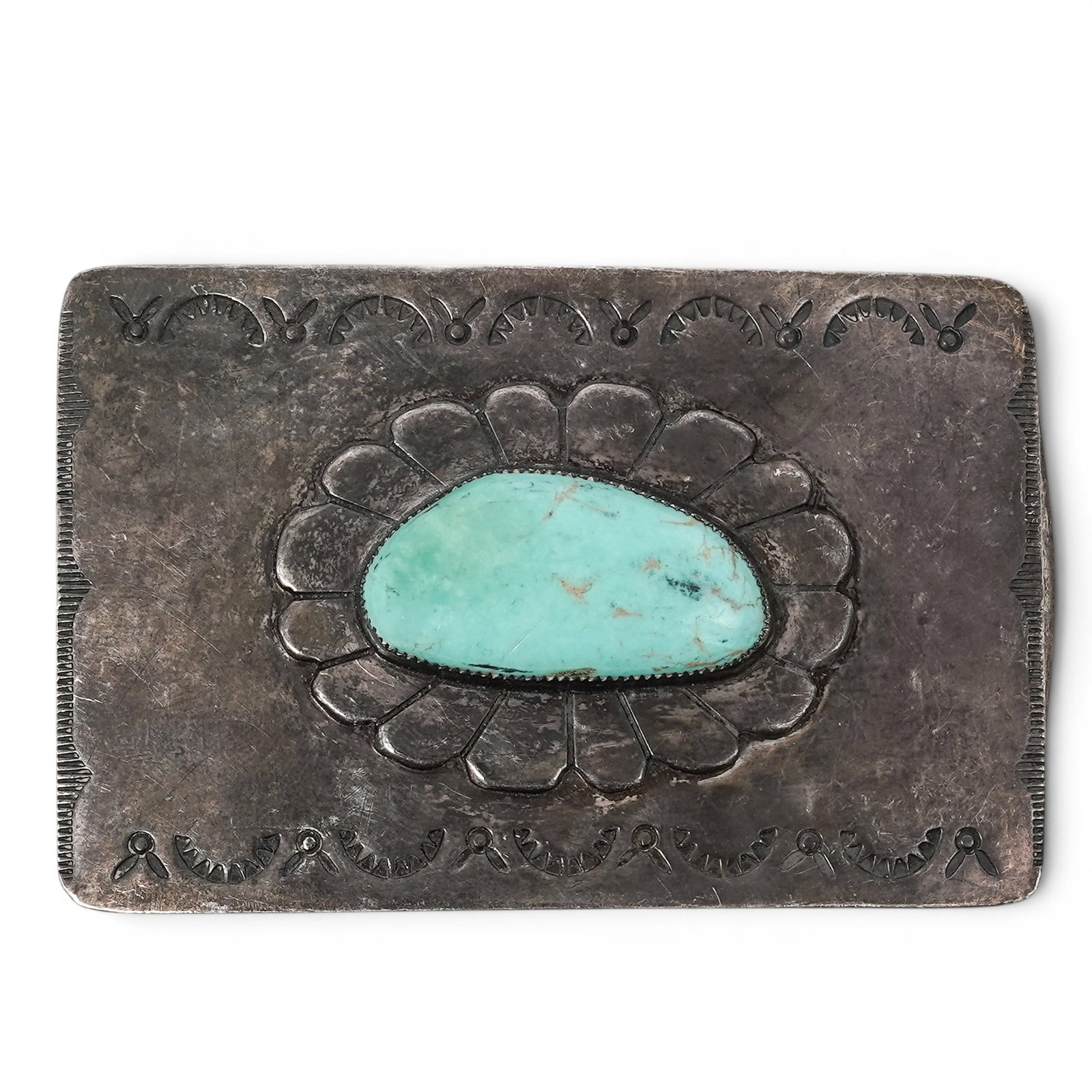 Vintage Navajo Sterling Silver & Turquoise Stamped Belt Buckle: Vintage Navajo Sterling Silver & Turquoise Stamped Belt Buckle 1970-1980s, USA Vintage Navajo sterling silver belt buckle featuring a central oval turquoise cabochon set within a raised bezel and surr