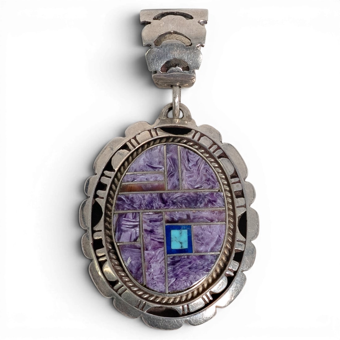 Vintage Zora Joe Navajo Sterling Silver & Multi-Stone Inlay Pendant: Vintage Zora Joe Navajo Sterling Silver & Multi-Stone Inlay Pendant 1970-1980s, USA Vintage sterling silver pendant featuring an intricate geometric mosaic inlay centered around richly patterned purpl