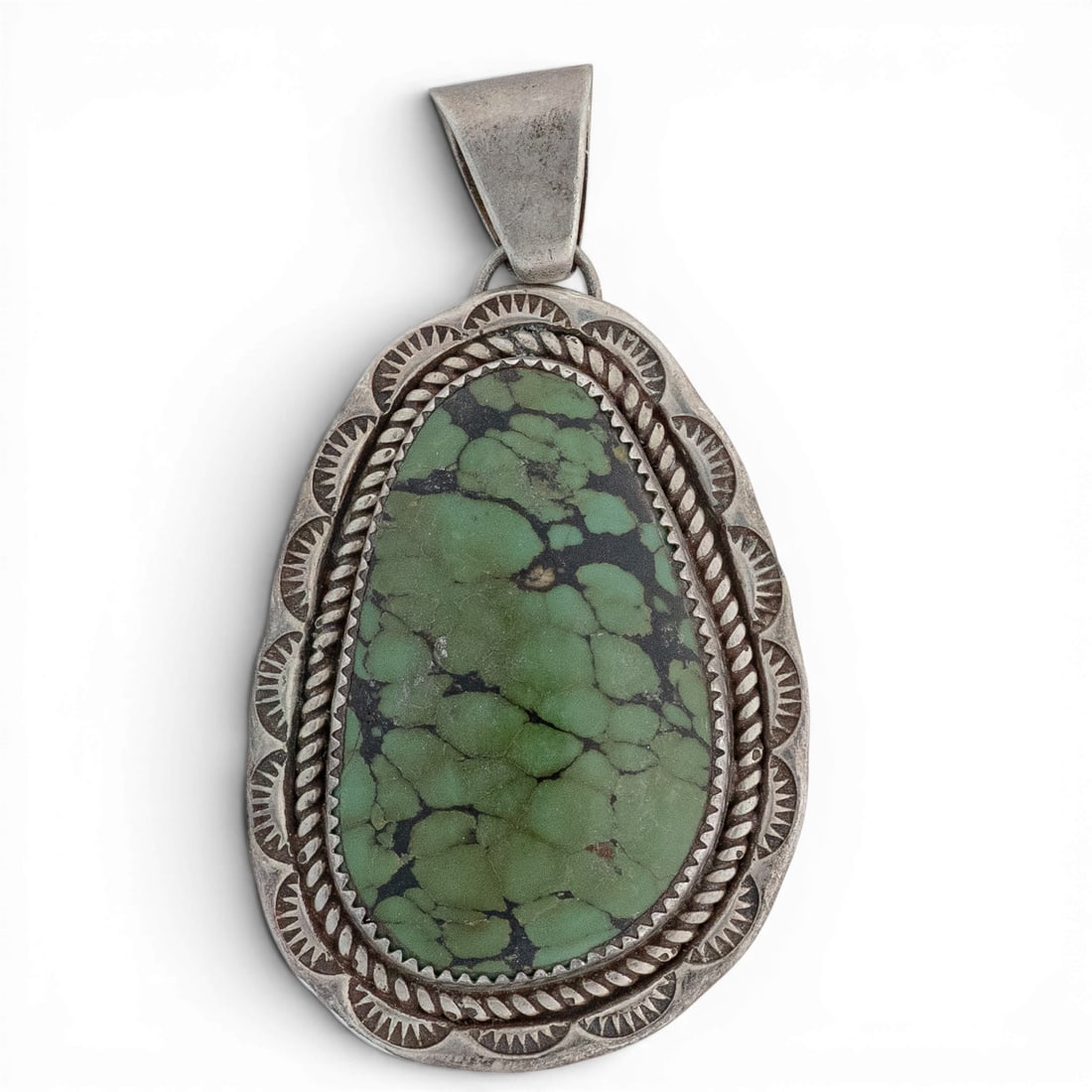 Vintage Robert & Charlene Little Navajo Sterling Silver & Green Turquoise Pendant: Vintage Robert & Charlene Little Navajo Sterling Silver & Green Turquoise Pendant 1970-1980s, USA Vintage sterling silver pendant featuring a substantial green turquoise cabochon, bezel-set within a t