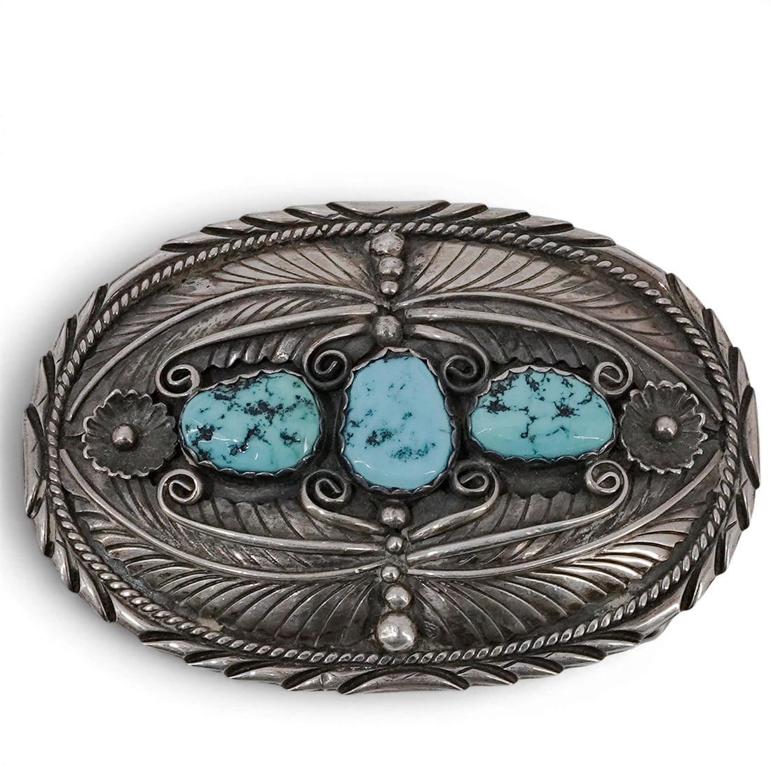 Vintage Linette Laiwakete Navajo Sterling Silver & Turquoise Feather Belt Buckle: Vintage Linette Laiwakete Navajo Sterling Silver & Turquoise Feather Belt Buckle 1970-1980s, USA Vintage sterling silver oval belt buckle featuring three natural turquoise cabochons in serrated bezels