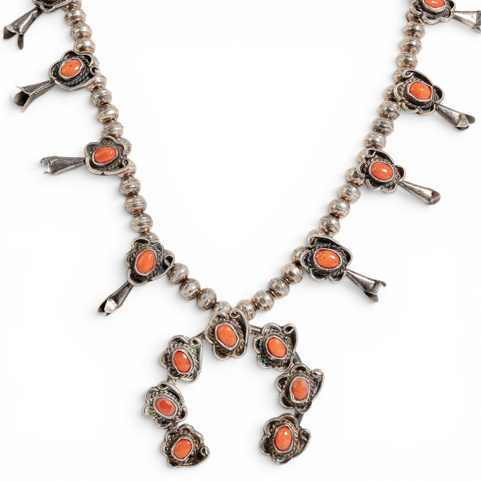 Vintage Navajo Sterling Silver & Coral Squash Blossom Necklace: Vintage Navajo Sterling Silver & Coral Squash Blossom Necklace 1970s-1980s, USA Vintage Navajo sterling silver squash blossom necklace featuring silver bead construction with coral cabochon blossom st