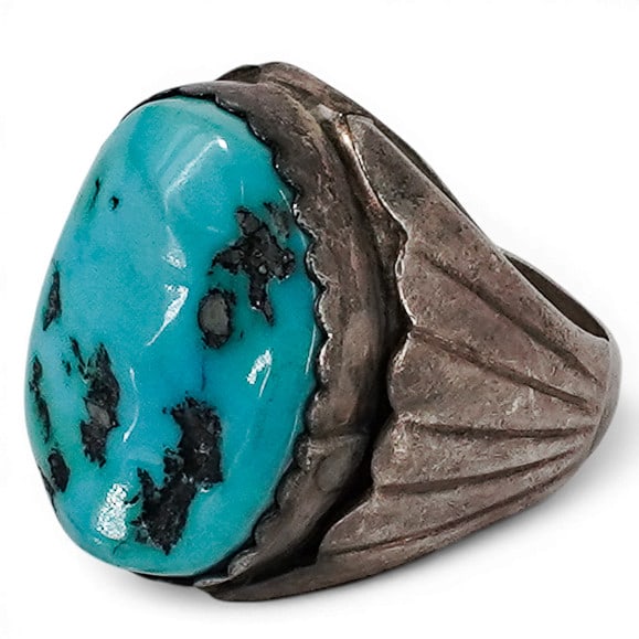 Vintage Navajo Sterling Silver & Turquoise Ring: Vintage Navajo Sterling Silver & Turquoise Ring 1970-1980s, USA Vintage Navajo sterling silver ring featuring a large oval turquoise cabochon in a serrated bezel setting. The stone is mounted within a