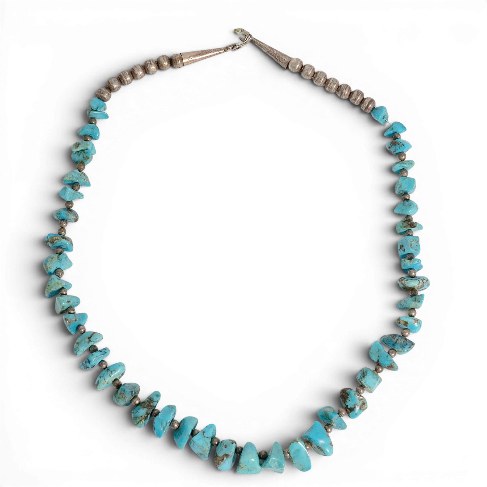Vintage Navajo Sterling Silver & Turquoise Nugget Necklace: Vintage Navajo Sterling Silver & Turquoise Nugget Necklace 1970s-1980s, USA Vintage Navajo sterling silver necklace featuring natural turquoise nugget beads with silver spacer beads. The necklace has 