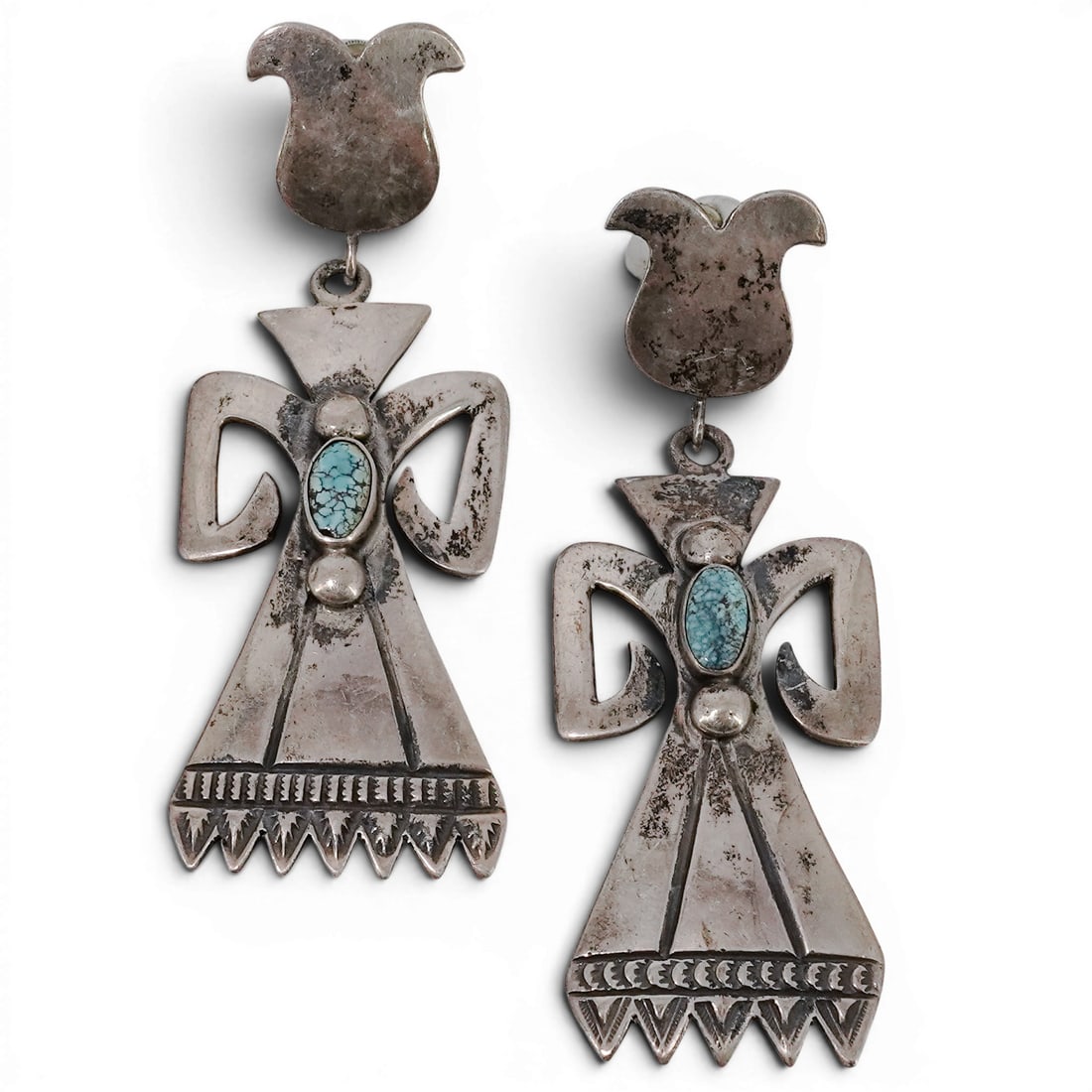 Vintage Lewis Lomay Hopi Sterling Silver & Turquoise Kachina Earrings: Vintage Lewis Lomay Hopi Sterling Silver & Turquoise Kachina Earrings 1970-1980s, USA Pair of vintage sterling silver dangle earrings in the form of stylized Kachinas, each centered with an oval turqu