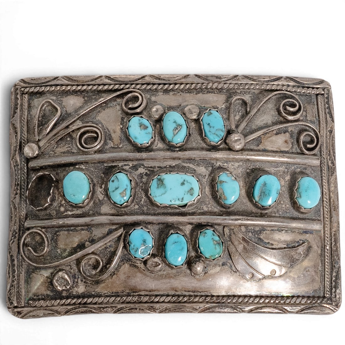 Vintage Navajo Sterling Silver & Turquoise Belt Buckle: Vintage Navajo Sterling Silver & Turquoise Belt Buckle 1970-1980s, USA Vintage sterling silver belt buckle featuring twelve natural turquoise cabochons in sawtooth bezels arranged in vertical rows. De