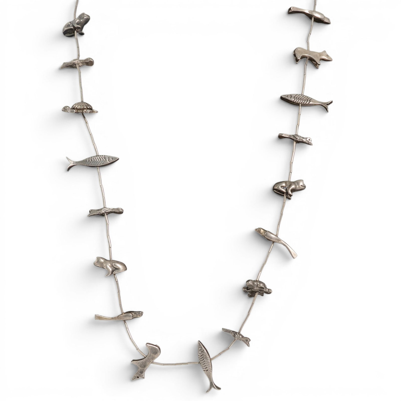 Vintage Navajo Sterling Silver Figural Animal Necklace: Vintage Navajo Sterling Silver Figural Animal Necklace 1970s -1980s, USA Vintage Navajo sterling silver necklace composed of cast and fabricated figural animal elements including fish, birds, frogs, a