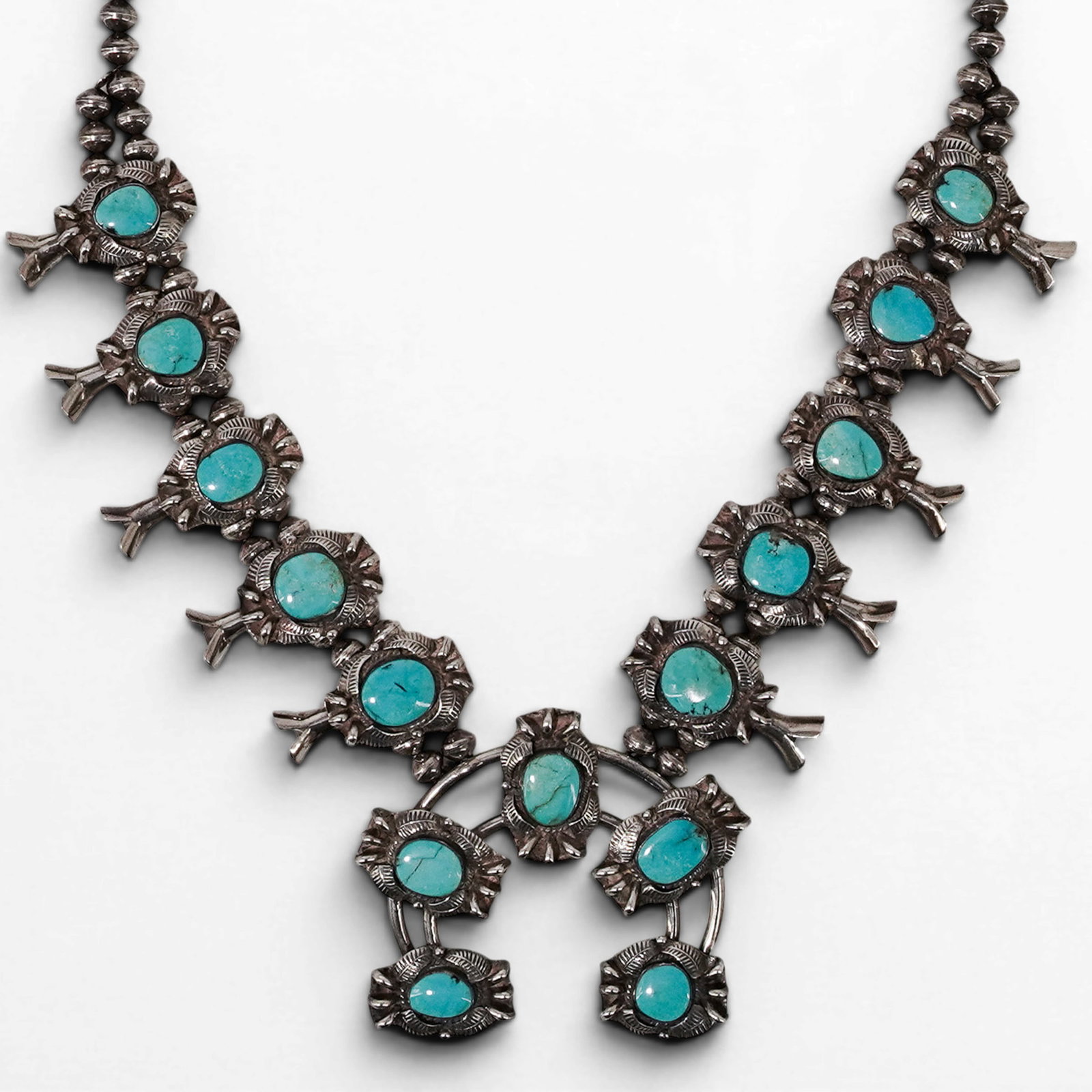 Vintage Robert Platero Navajo Sterling Silver & Turquoise Squash Blossom Necklace: Vintage Robert Platero Navajo Sterling Silver & Turquoise Squash Blossom Necklace 1970s, USA Vintage Navajo sterling silver squash blossom necklace by Robert Platero, constructed with double-strand si