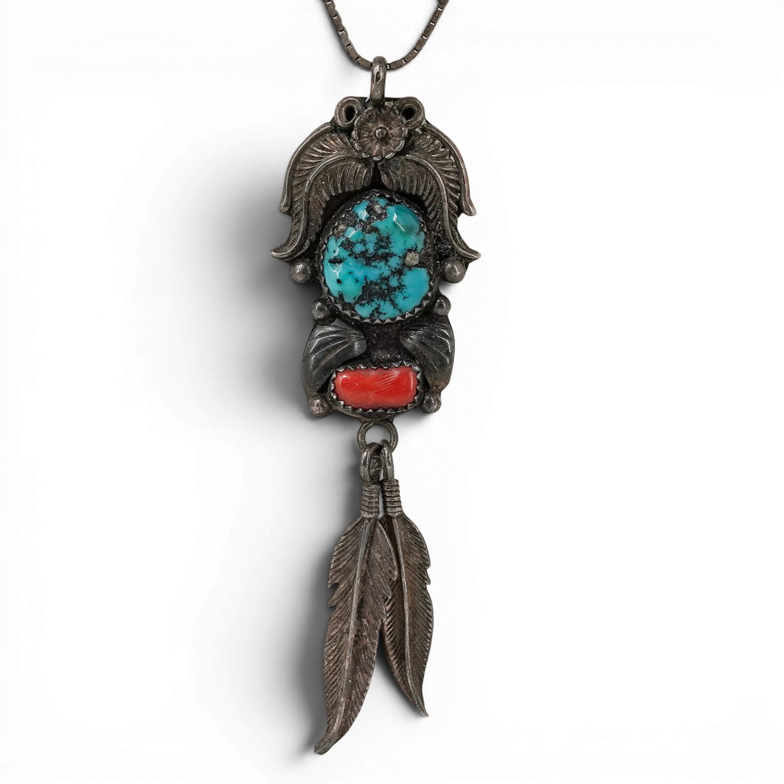 Vintage Navajo Sterling Silver Turquoise & Coral Feather Dangle Necklace: Vintage Navajo Sterling Silver Turquoise & Coral Feather Dangle Necklace 1970-1980s, USA Vintage sterling silver pendant necklace featuring an oval turquoise cabochon above a coral cabochon, accented 