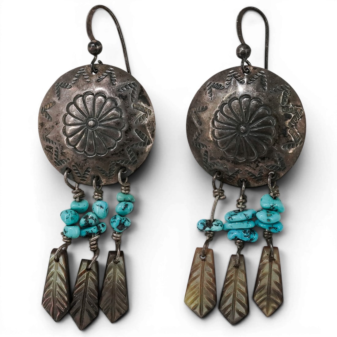 Vintage Navajo Sterling Silver & Turquoise Nugget Dangle Earrings: Vintage Navajo Sterling Silver & Turquoise Nugget Dangle Earrings 1970-1980s, USA Vintage sterling silver dangle earrings featuring stamped concho-style tops with repoussé floral centers and hand-sta
