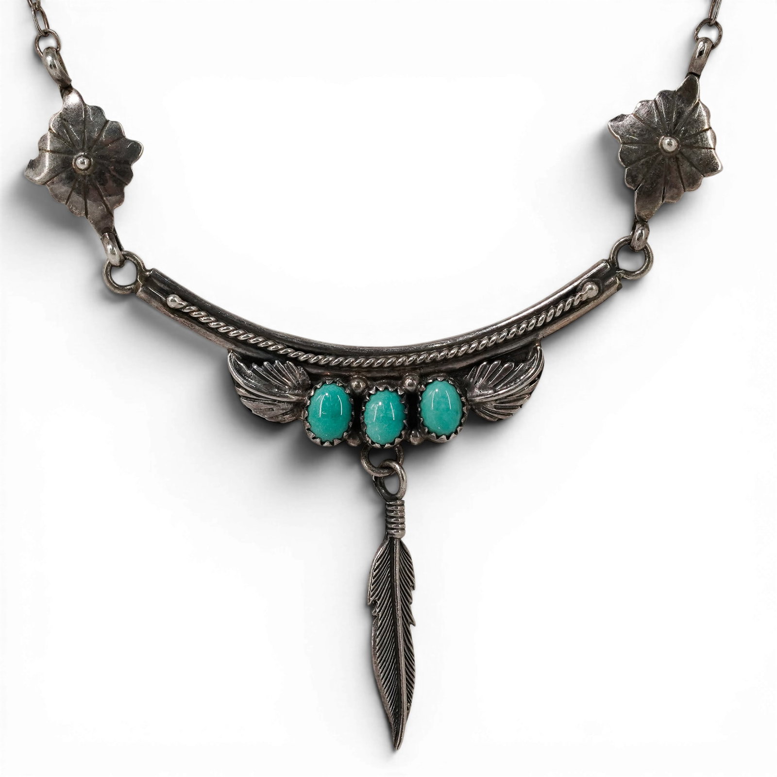 Vintage Navajo Sterling Silver & Turquoise Feather Drop Necklace Signed: Vintage Navajo Sterling Silver & Turquoise Feather Drop Necklace Signed 1970-1980s, USA Vintage sterling silver necklace featuring three oval turquoise cabochons in serrated bezels mounted within a cu