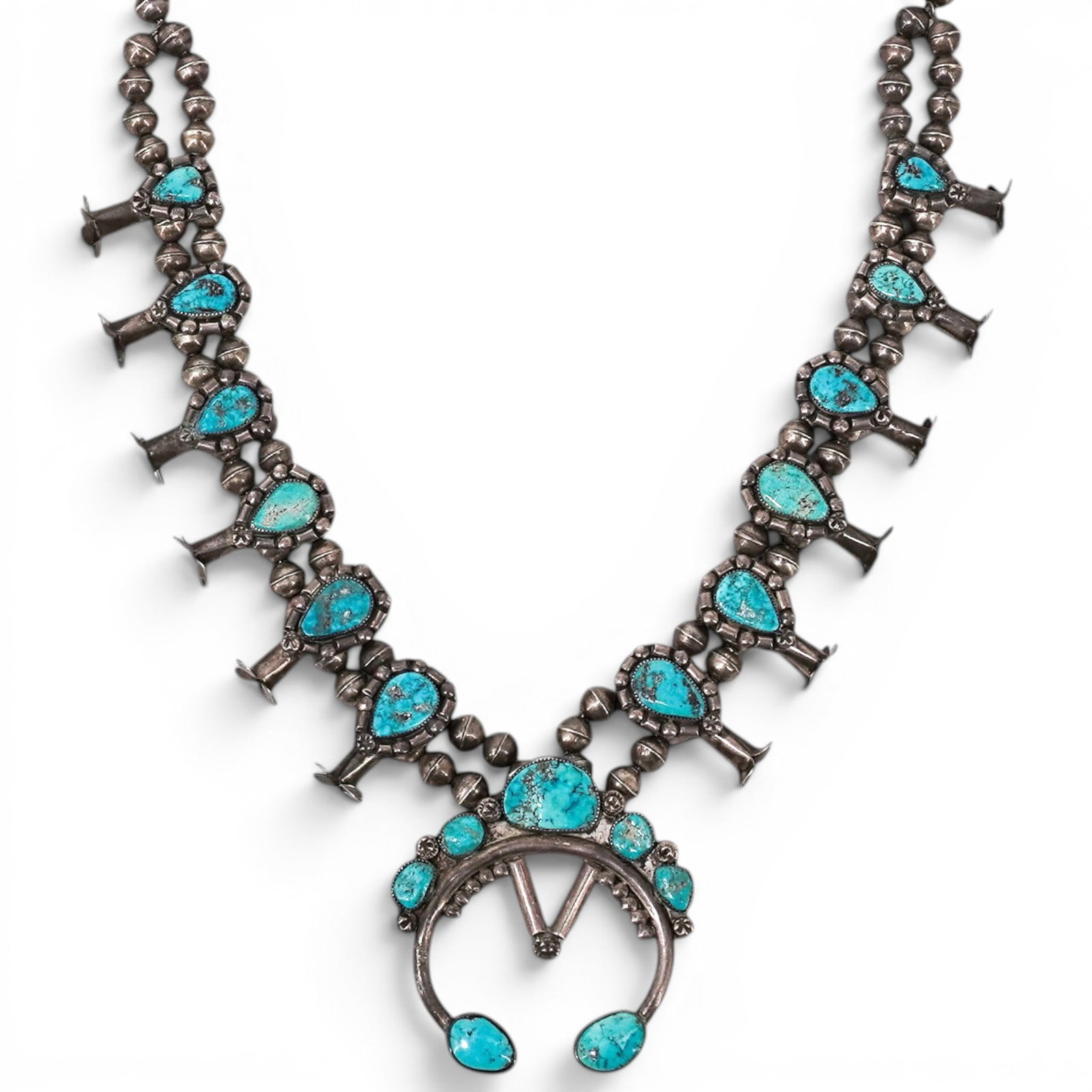 Navajo Sterling Silver & Turquoise Squash Blossom Necklace: Navajo Sterling Silver & Turquoise Squash Blossom Necklace 1970s-1980s, USA Vintage Navajo sterling silver squash blossom necklace with double strand silver bead construction, crescent naja centerpiec