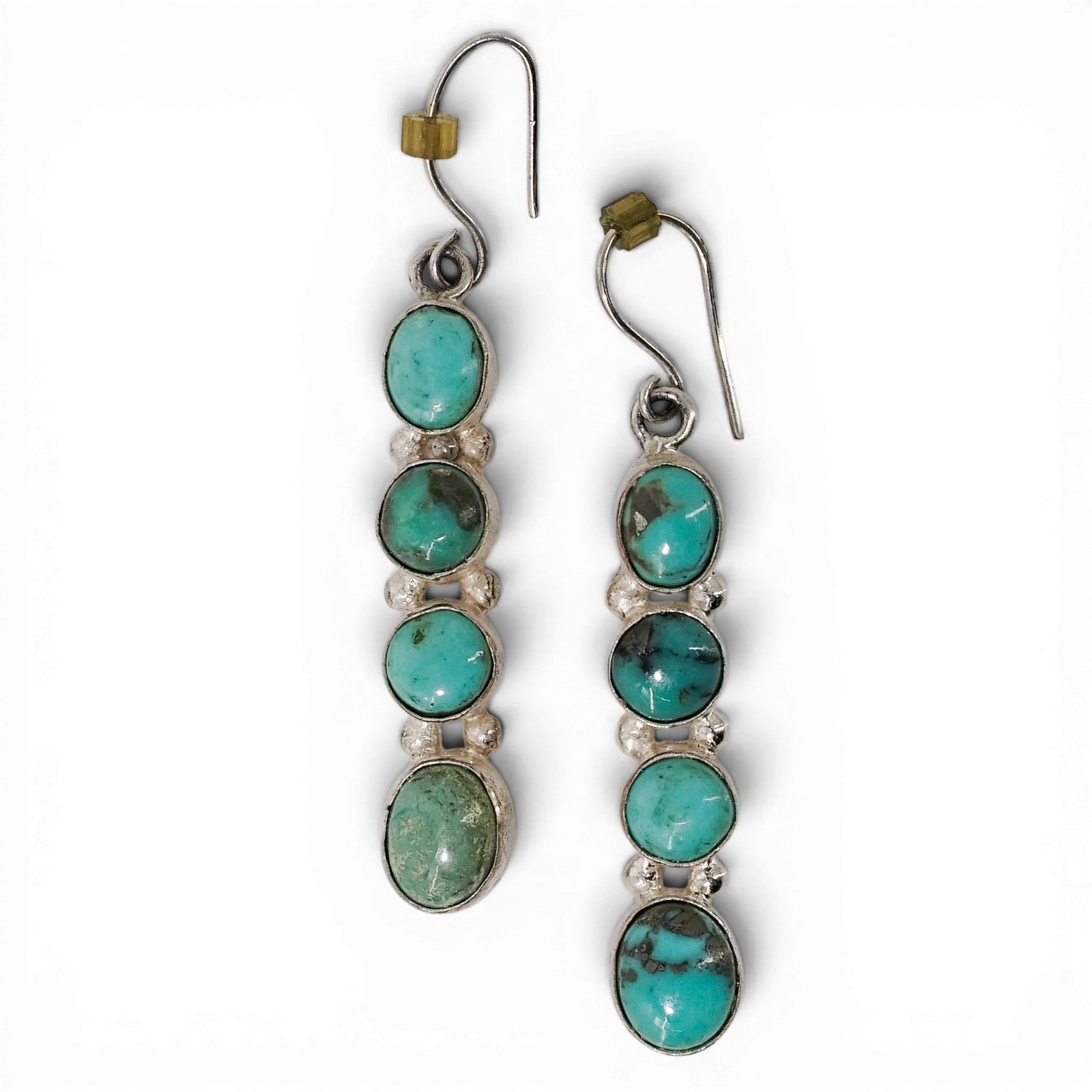 Vintage Navajo Sterling Silver & Turquoise Dangle Earrings: Vintage Navajo Sterling Silver & Turquoise Dangle Earrings 1970-1980s, USA Vintage Navajo sterling silver dangle earrings set with a vertical arrangement of oval turquoise cabochons. Each earring feat