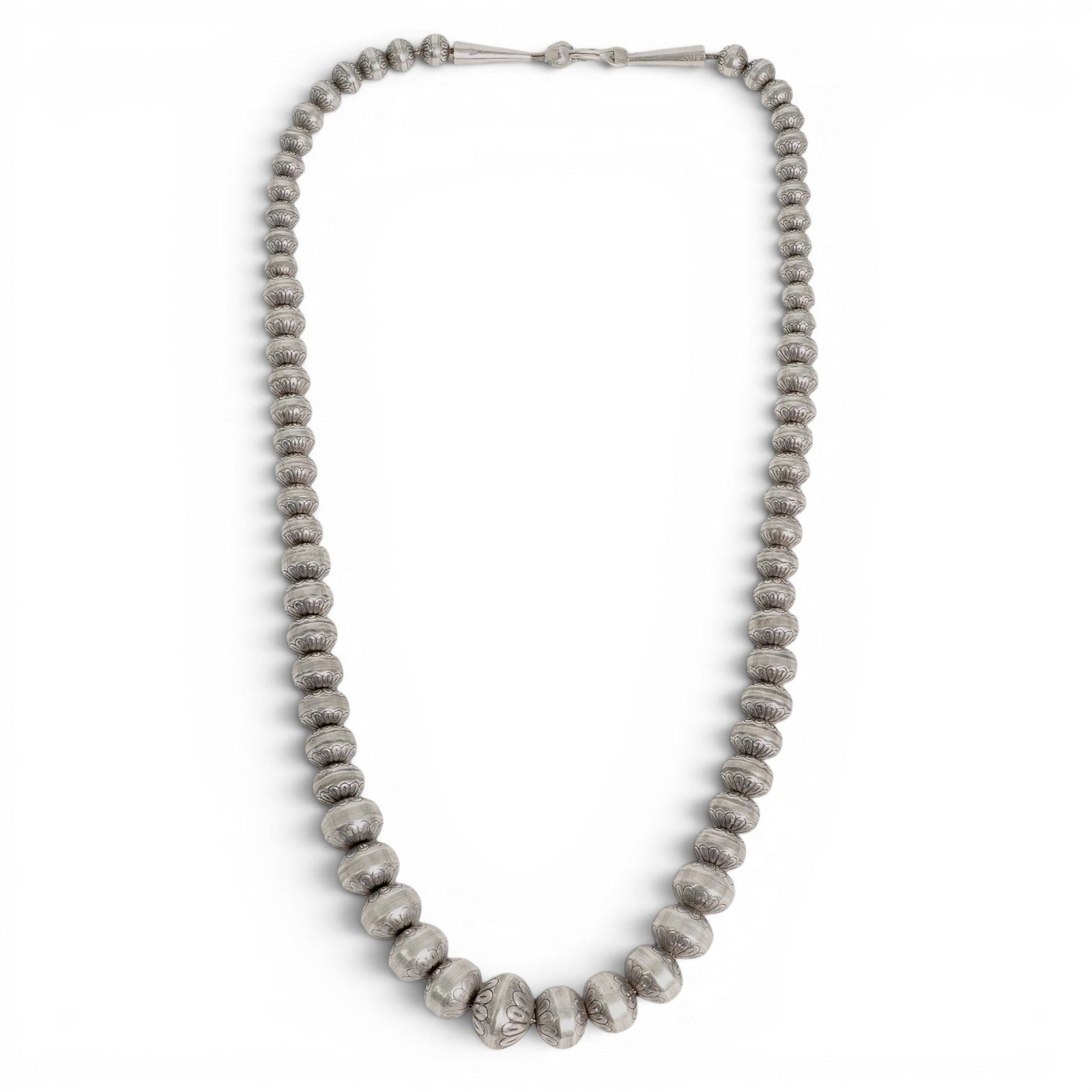 Vintage Navajo Sterling Silver Stamped Bead Necklace: Vintage Navajo Sterling Silver Stamped Bead Necklace 1970-1980s, USA Vintage Navajo sterling silver bead necklace with graduated round and saucer-form beads, decorated with stamped floral and scallope