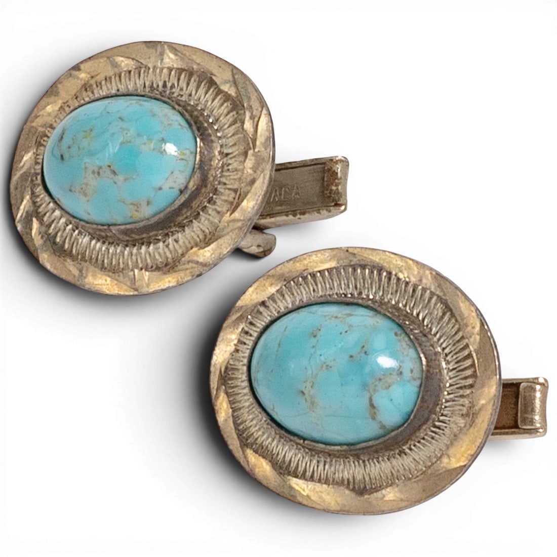 Mexican Sterling Silver & Turquoise Cufflinks: Mexican Sterling Silver & Turquoise Cufflinks 1970-1980s, Mexican Matching pair of sterling silver cufflinks featuring oval turquoise cabochons in bezel settings surrounded by hand-stamped sunburst de