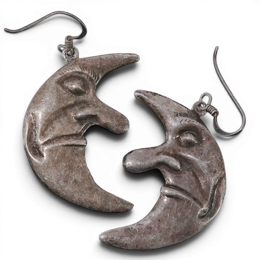 Vintage Sterling Silver Moon Face Earrings: Vintage Sterling Silver Moon Face Earrings 1970-1980s, USA Pair of sterling silver earrings cast in the form of stylized faces with crescent moon profiles, raised facial features, and constructed with