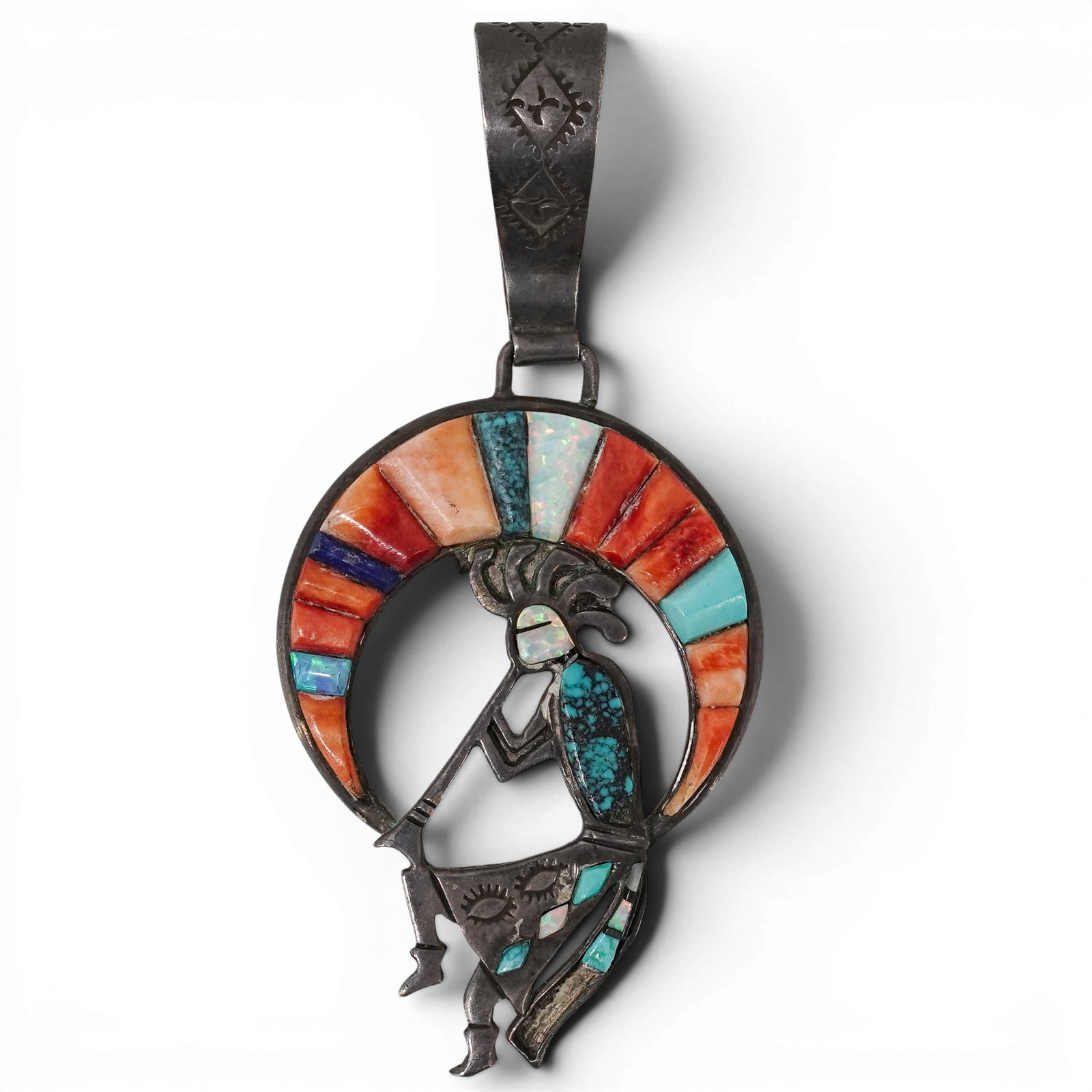 Vintage Herman Lee Navajo Sterling Silver & Multi-Stone Inlay Kokopelli Pendant: Vintage Herman Lee Navajo Sterling Silver & Multi-Stone Inlay Kokopelli Pendant 1970-1980s, USA Vintage sterling silver pendant by Herman Lee, depicting Kokopelli displaying channel inlay including tu
