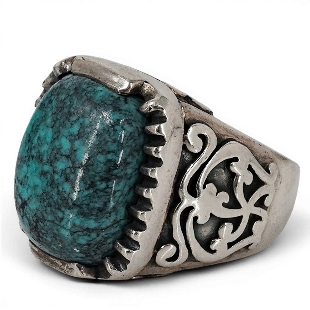 Indian Sterling Silver & Turquoise Ring Signed: Indian Sterling Silver & Turquoise Ring Signed Late 20th Century, Indian Sterling silver ring featuring a substantial rectangular turquoise cabochon displaying blue-green coloration with natural dark 