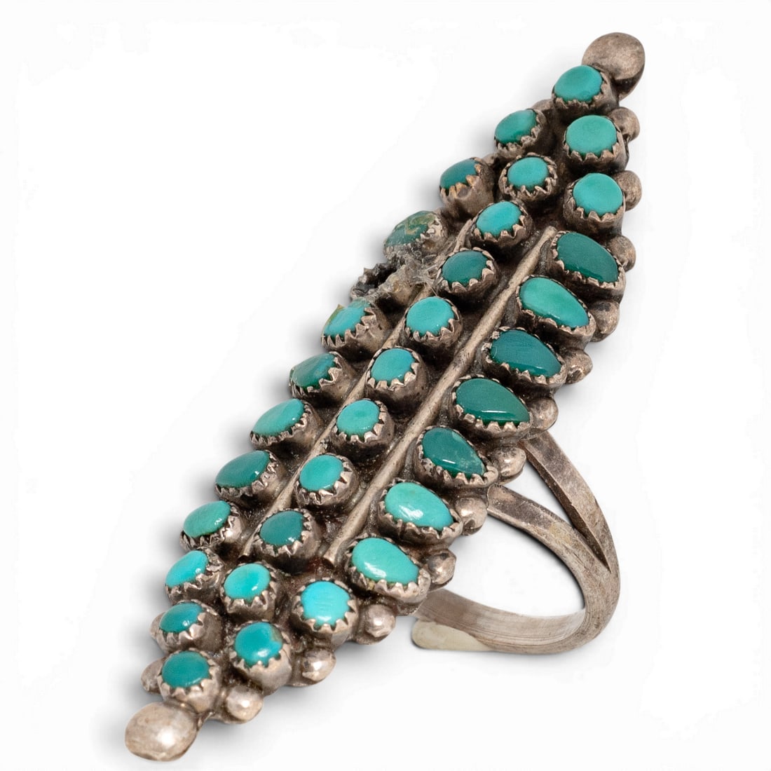 Vintage Zuni Sterling Silver & Snake Eye Turquoise Ring: Vintage Zuni Sterling Silver & Snake Eye Turquoise Ring 1970s-1980s, USA Handcrafted sterling silver ring featuring Snake eye petit point turquoise cabochons in serrated bezel settings arranged in a l