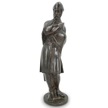 Unusual Antique Bronze Standing Northsman W/ Cape And Helmet: Unusual Antique Bronze Standing Northsman W/ Cape And Helmet 19th cent. European Bronze sculpture depicting a bearded norseman donning a helmet and wrapping himself in his cape. H: 15.25" W: 4.25" L: 