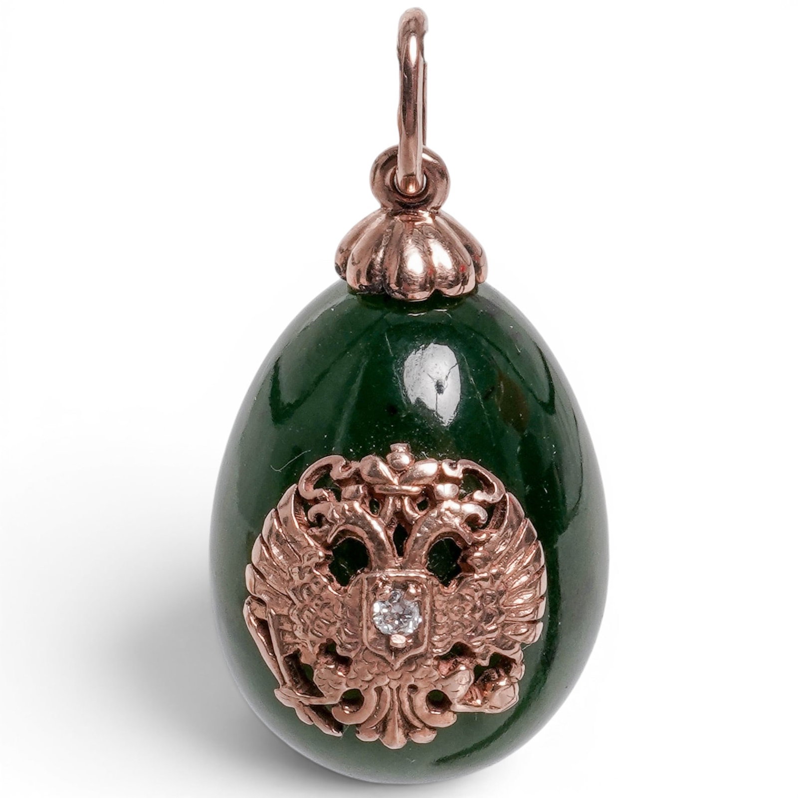 Imperial Russian Era Rose Gold Nephrite Easter Egg Pendant: Imperial Russian Era Rose Gold Nephrite Easter Egg Pendant 20th Century, Russian Russian Imperial egg-form pendant carved from polished nephrite and mounted with an openwork 56-zolotnik rose gold Impe