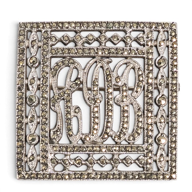 Vintage Sterling Silver & Marcasite Monogram Brooch: Vintage Sterling Silver & Marcasite Monogram Brooch Late 20th Century Sterling silver openwork rectangular brooch with applied script monogram reading "RDB" and geometric border set throughout with ma