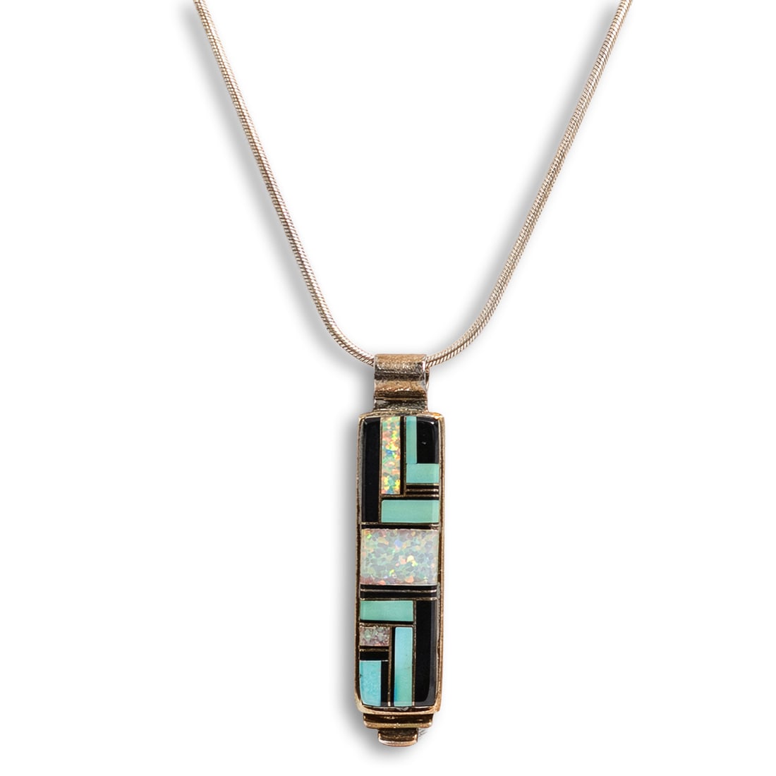Cynthia Begay Navajo Sterling Silver & Multi-Inlay Pendant Necklace: Cynthia Begay Navajo Sterling Silver & Multi-Inlay Pendant Necklace Late 20th Century, USA Sterling silver pendant necklace with rectangular Southwestern channel inlay pendant set with natural turquoi