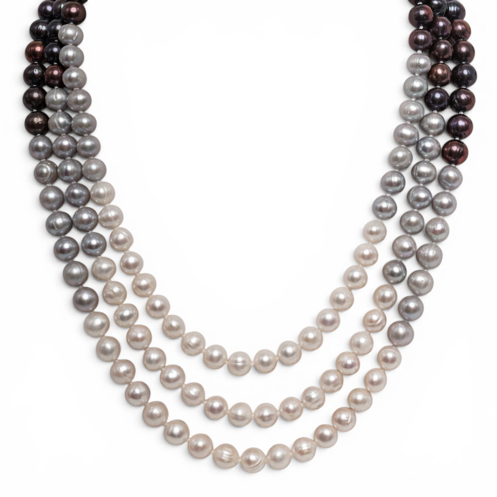 Multi-strand Peacock & White Pearl Necklace: Multi-strand Peacock & White Pearl Necklace 20th century A three-strand pearl necklace with white, light gray, and peacock pearls. Silver-tone spring ring clasp. Included in a rosy pink presentation b