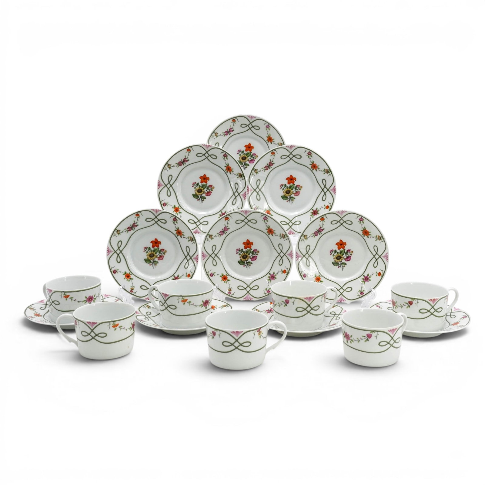 (18pc) Raynaud Limoges "Guirlandes" Cup & Saucers Set: (18pc) Raynaud Limoges "Guirlandes" Cup & Saucers Set 20th Cent.,French This set features a continuous looping green line motif forming an interlocking bow/scroll design interspersed with tiny multico
