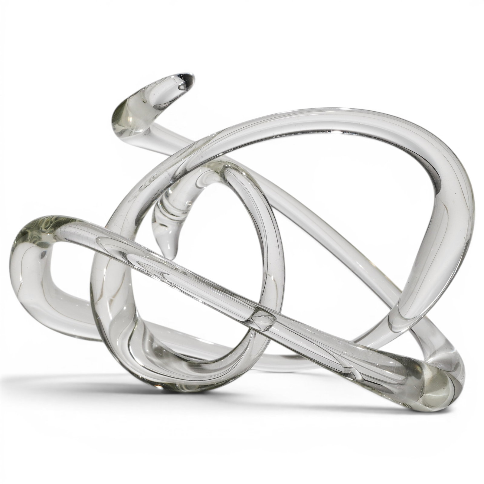 Murano Art Glass Knot Sculpture: Murano Art Glass Knot Sculpture Mid 20th Cent, Italy Murano art glass knot sculpture formed as an interwoven loop with flowing ribbon-like elements. Executed in hand-blown art glass, the sculpture fea