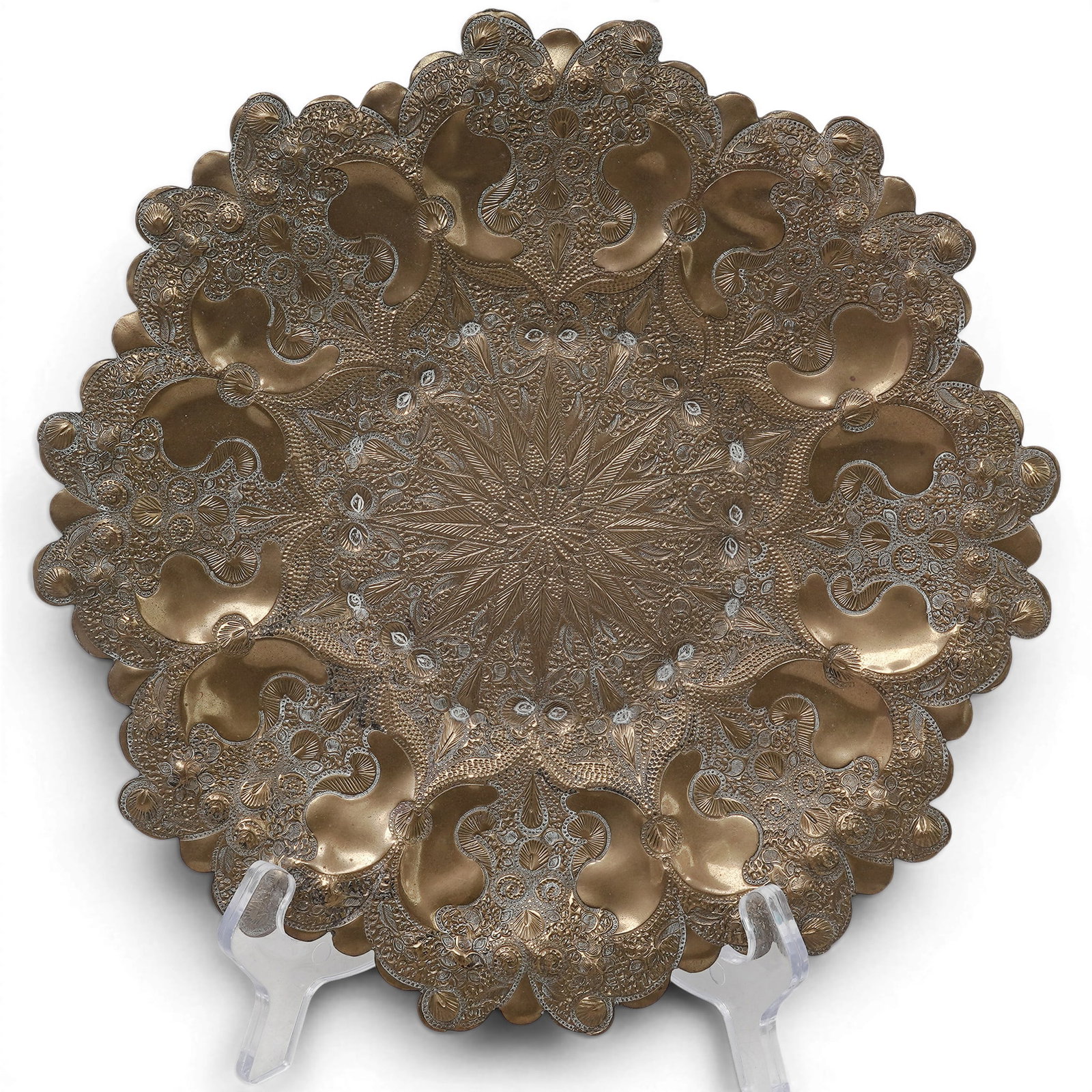 Moroccan Brass Repousse Decorative Plate: Moroccan Brass Repousse Decorative Plate 20th century, Moroccan The elaborate, hammered patterns are highly characteristic of traditional Middle Eastern, Moroccan or Indo-Persian metalwork. 10" diamet