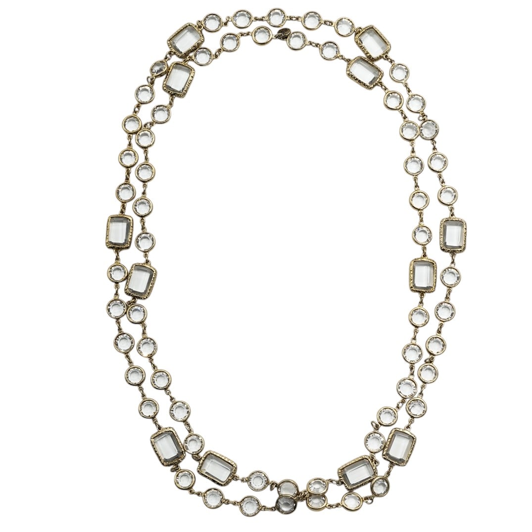 Chanel Long Gold Tone Crystal Station Necklace: Chanel Long Gold Tone Crystal Station Necklace1981, FrenchLong station necklace composed of alternating round and rectangular faceted clear stones in textured gold tone bezels, connected by link chain