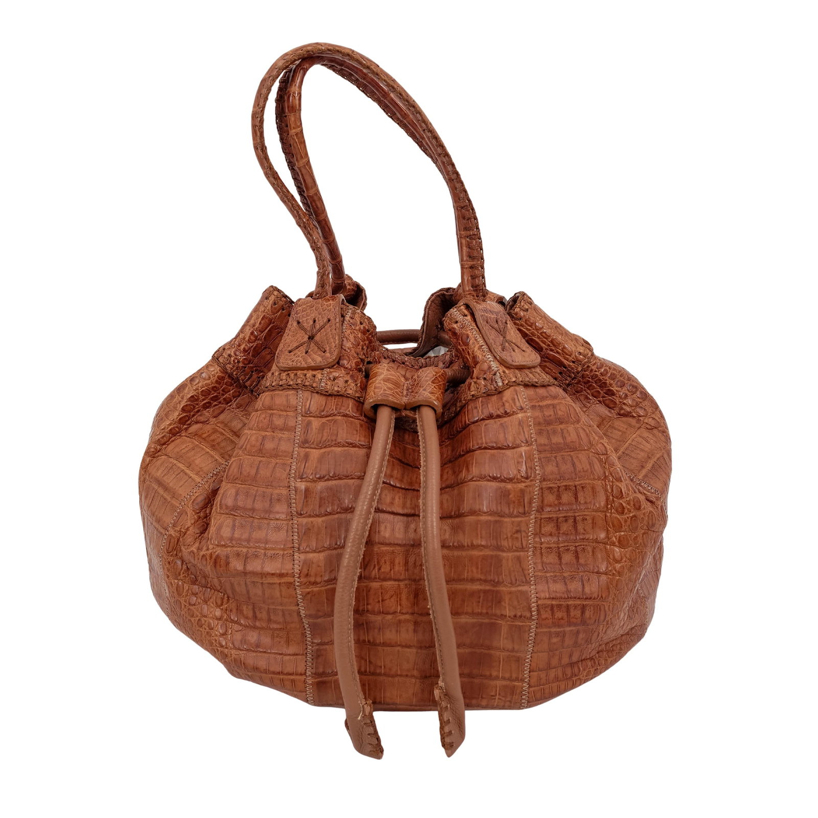 Carlos Falchi "Fatto A Mano" Crocodile Bucket Bag: Carlos Falchi "Fatto A Mano" Crocodile Bucket BagLate 20th c., USAHandmade bucket bag crafted from genuine crocodile skin, featuring a rich cognac-brown exterior and signature whipstitched detailing.