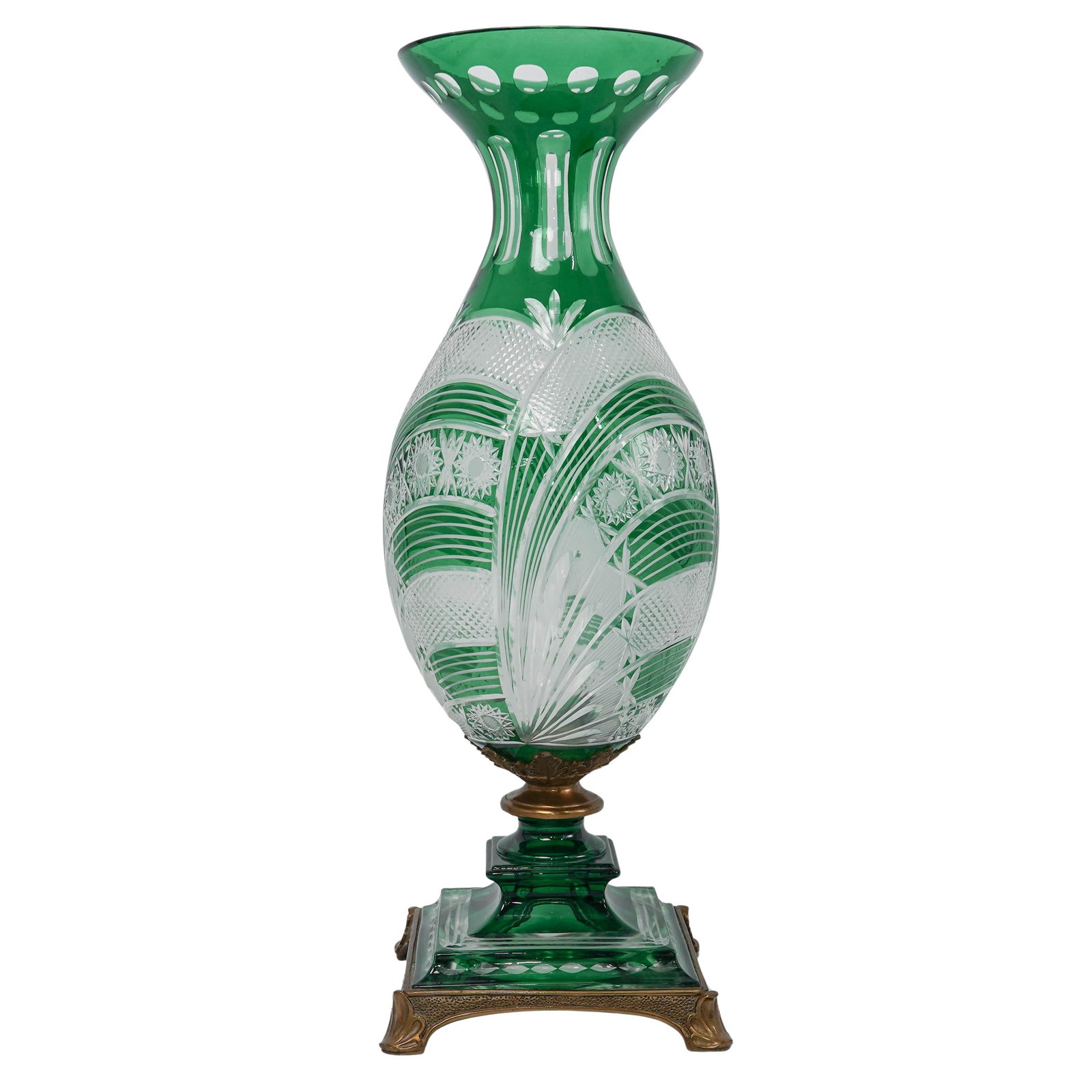 Bohemian Emerald Green To Clear Crystal Vase: Bohemian Emerald Green To Clear Crystal VaseMid 20th Cent. CzechThe vase features a vibrant emerald green casing that beautifully highlights the clear crystal beneath The body is decorated with a comp