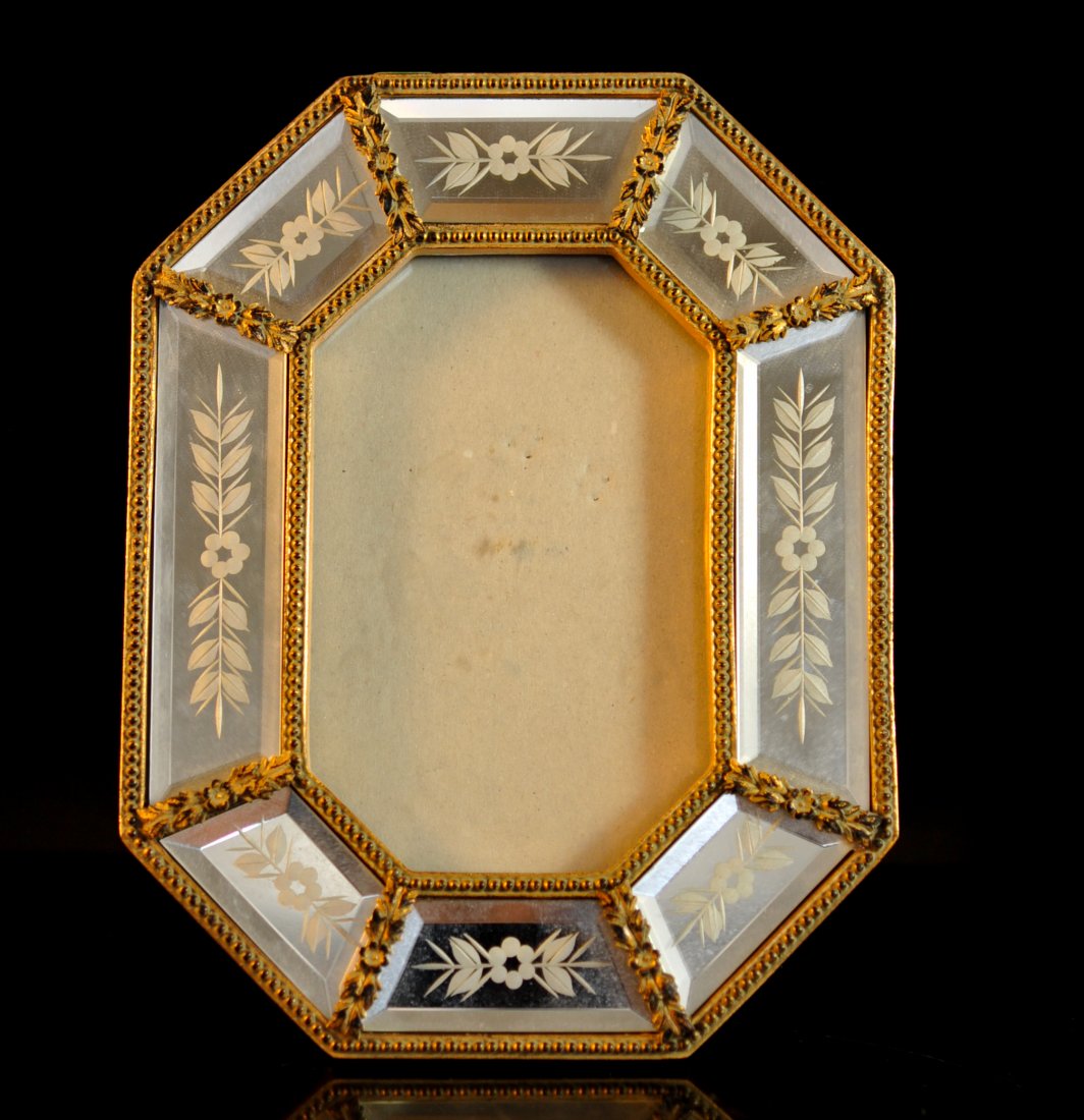 Vintage Venetian dore wood and glass frame: DESCRIPTION: Vintage Venetian dore wood and glass frame. Features separate beveled mirror tiles etched with a floral motif. Each bordered by hand carved dore wood in a foliate motif. Black velvet back