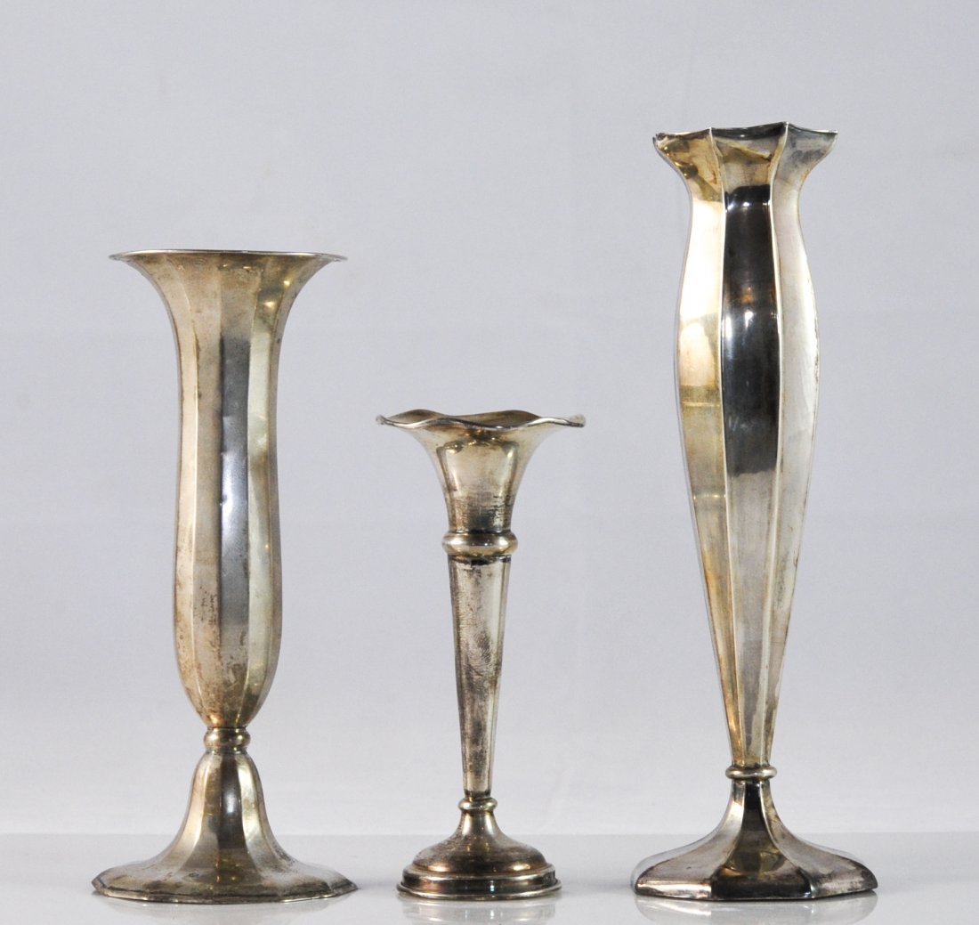 Set of three Art Deco silver flower vases: DESCRIPTION: Set of three Art Deco sterling flower vases. Three silver vases with different styles and sizes. All three have wide mouth designs and stamped with different hallmarks (Lion passant, Germ