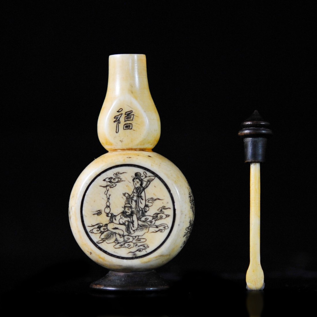 Antique Chinese hand carved scrimshaw snuff bottle: DESCRIPTION: Antique Chinese hand carved scrimshaw snuff bottle. Features a moon style body with a tear drop neck. All sides are engraved with figures and foliage with the neck having Chinese characte
