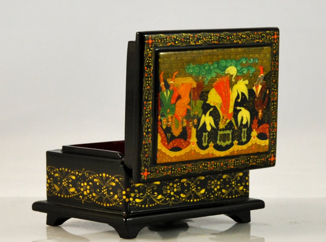 Hand painted USSR lacquered art box. Mint: DESCRIPTION: Soviet Union lacquer art box. The lid of box is completely hand painted with folklore scenes. Depiction of a king in the castle scene with his servants entertaining him. A woman dances in